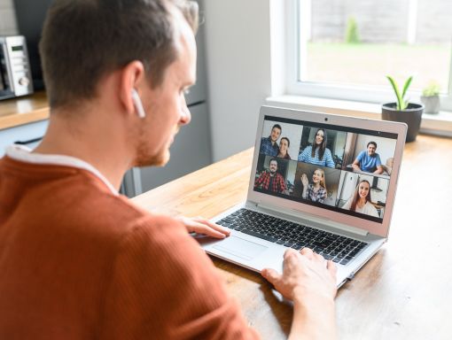 Person on a Zoom call with a small group of fellow co-parents, mirroring the biweekly cohort experience of Group Coaching